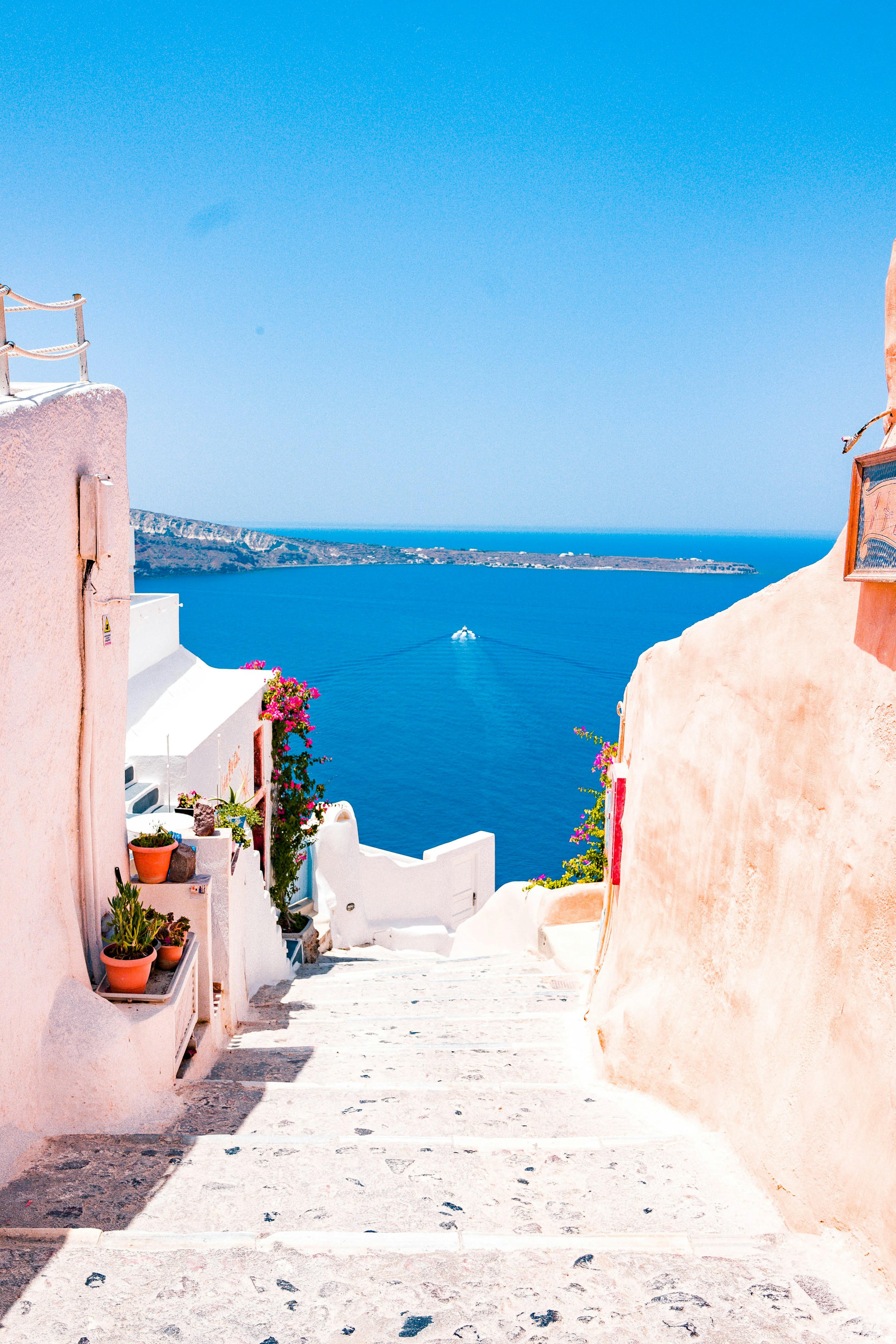 White steps leading down to the caldera in Oia, Santorini